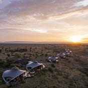 Aerial view of Mahali Mzuri Safari Camp nestled in Kenya’s Olare Motorogi Conservancy, surrounded by vast savannah and wildlife-rich landscapes